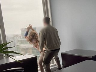 MILF boss fucked against the brush place window